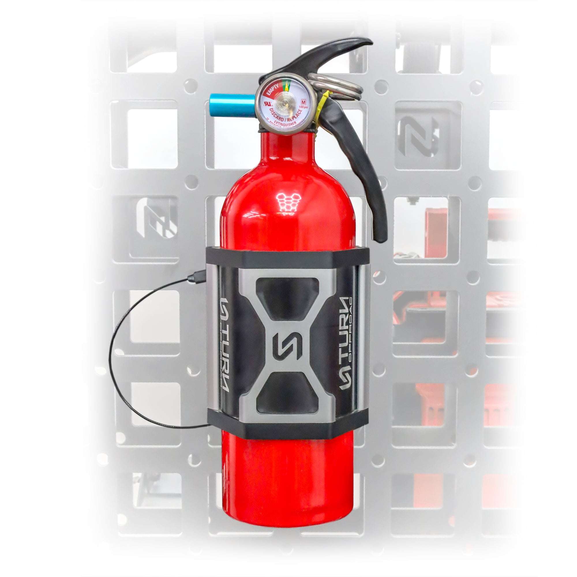Fire extinguisher ready for quick release in vehicle