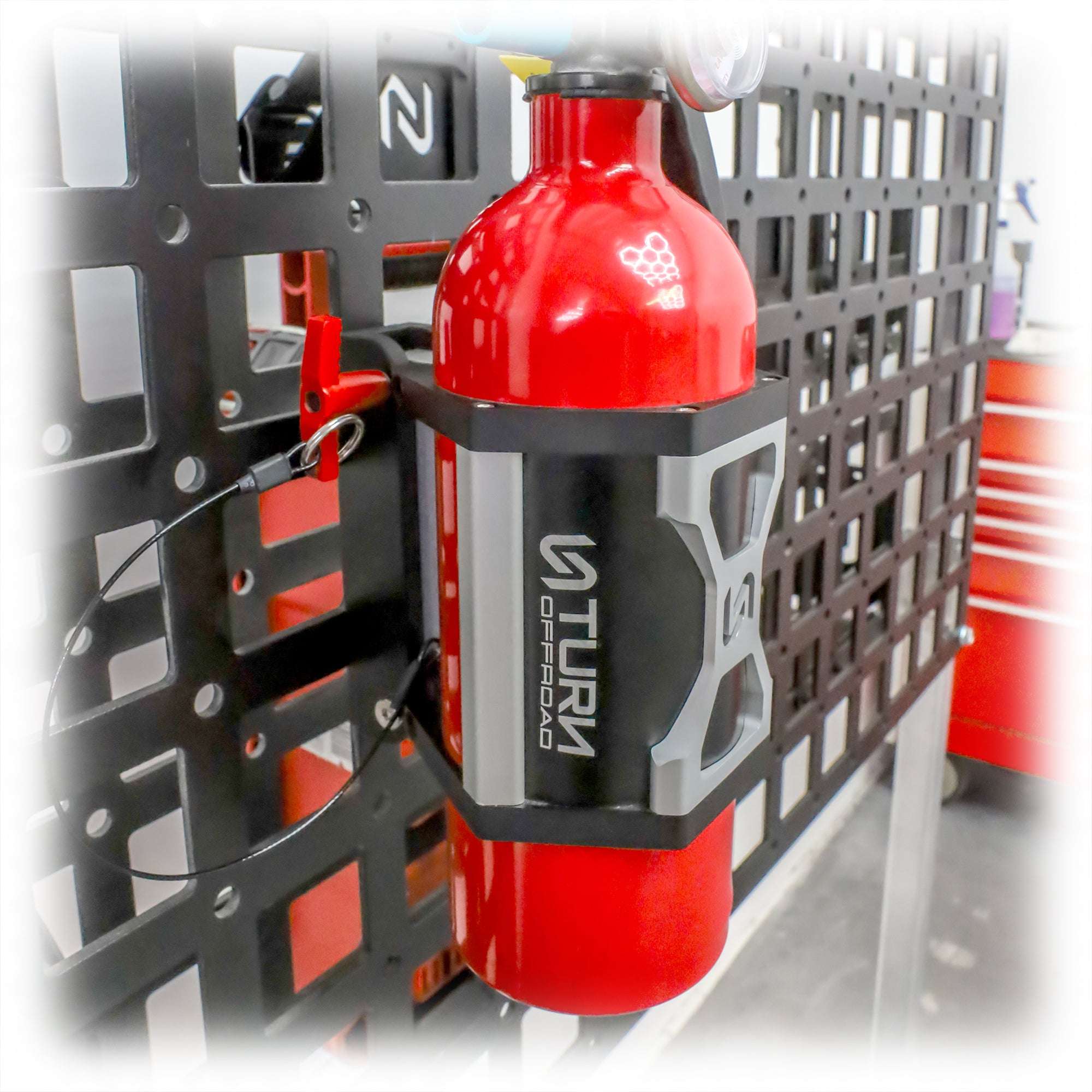 fire extinguisher secured in vehicle safety mount