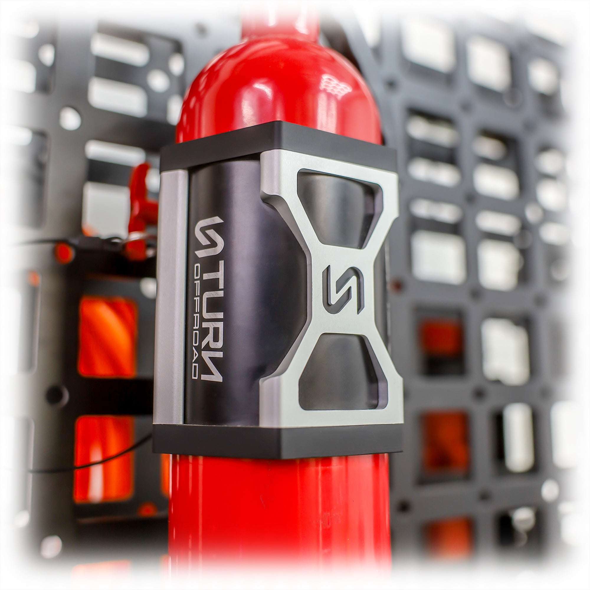 Close-up of fire extinguisher with secure mounting bracket