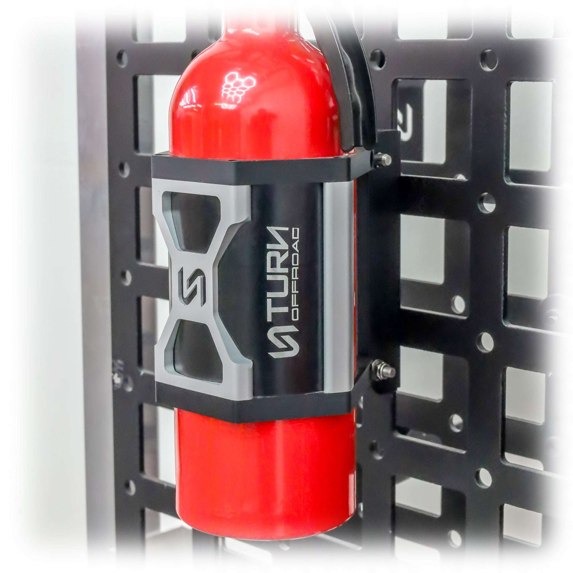 Fire extinguisher in quick release mount on wall