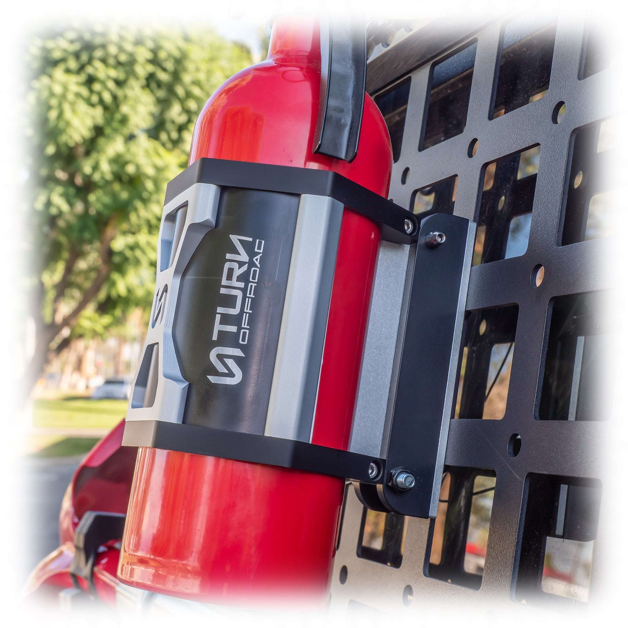 close-up of fire extinguisher secured in vehicle mount